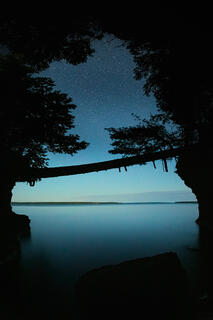 moonlight and stars in a secluded cove on bear island in the apostle islands national lakeshore