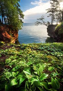 cat island cliffs with brilliant green vegetation in the apostle islands