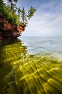 crystal clear water and underwater sand ripples illuminated by the sunshine on cat island in the apostle islands national lakeshore