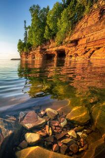 underwater boulders and stones visible through clear water on devil's island during sunset on lake superior wisconsin
