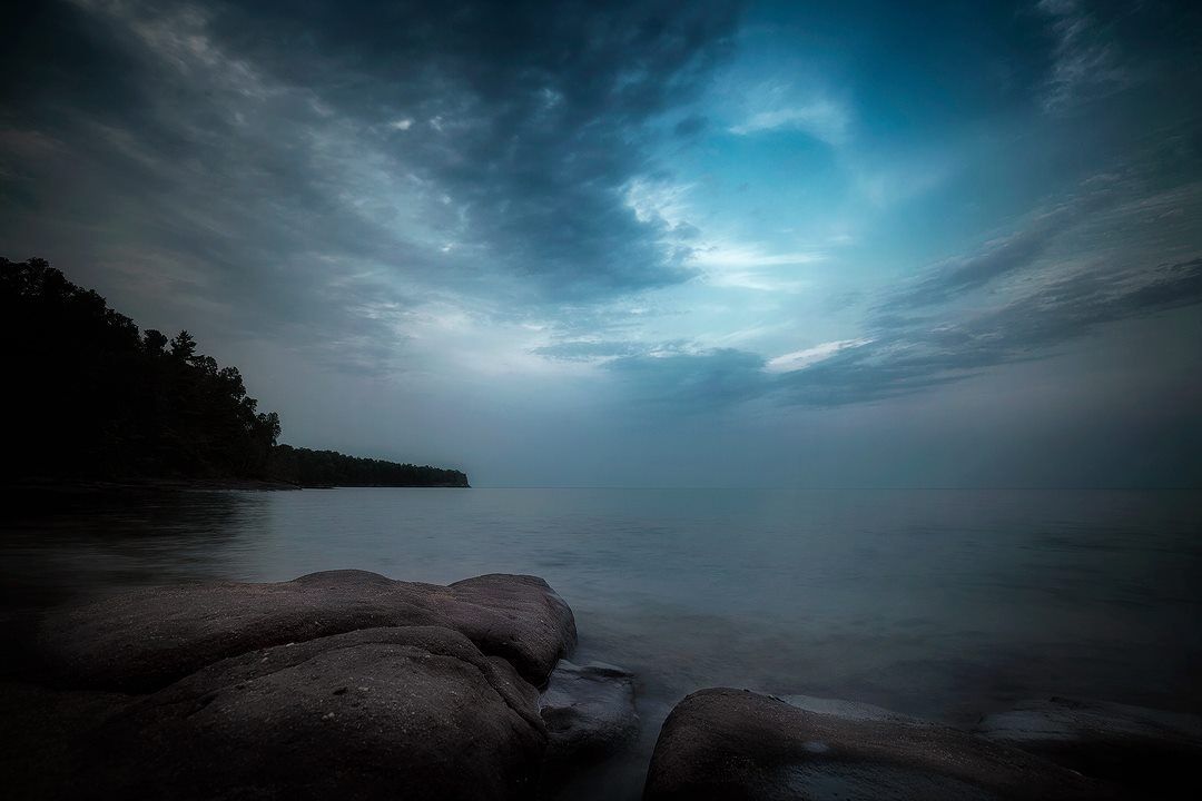 dark stormy night on rocky beach