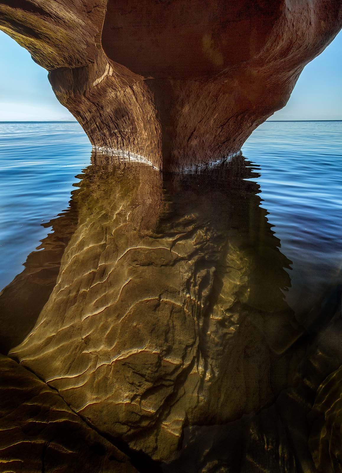 underwater sandstone structure in evening light on cat island in the  apostle islands national lakeshore