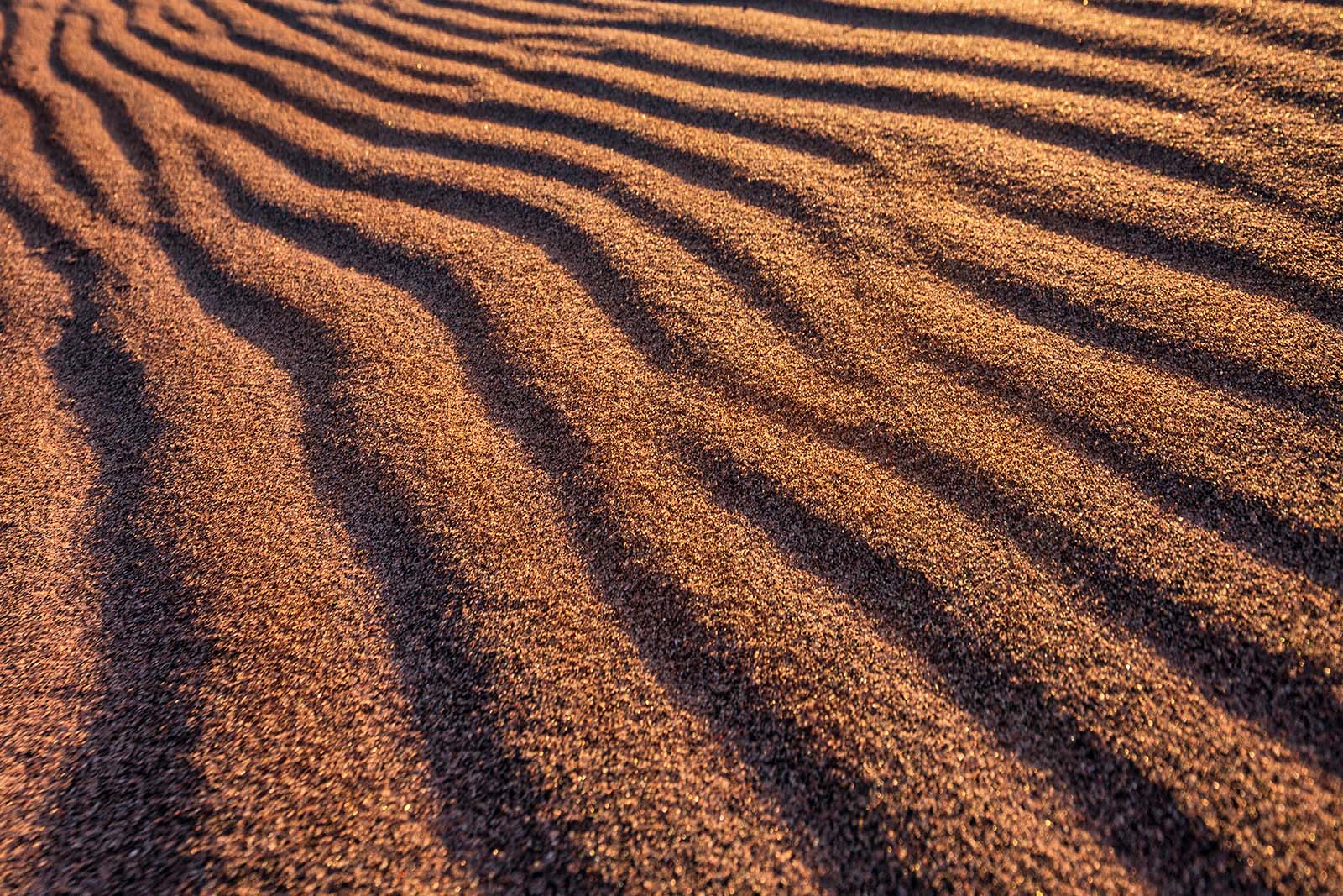 beach sand with wave patterns on michigan island in the apostle islands