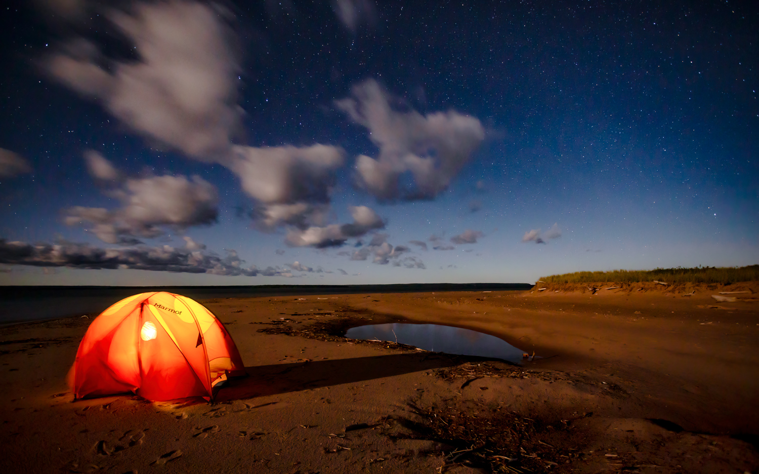 A glowing tent at night on Michigan Island in the Apostle Islands National Lakeshore.