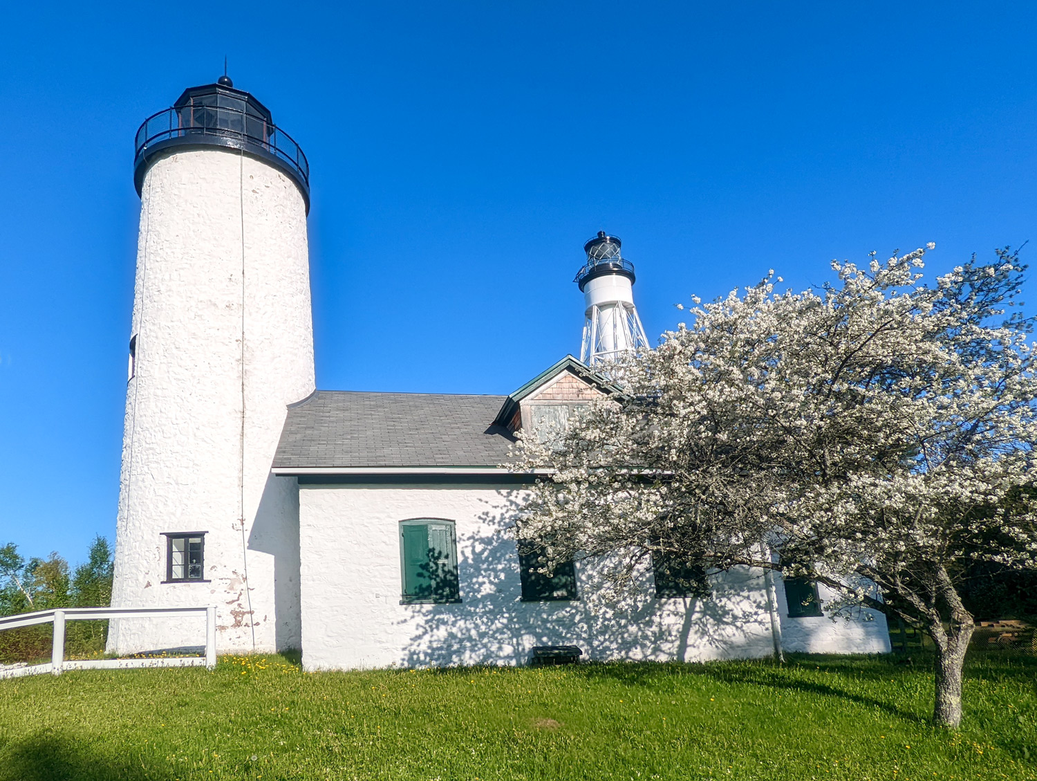 historic michigan island lighthouse apple blossoms