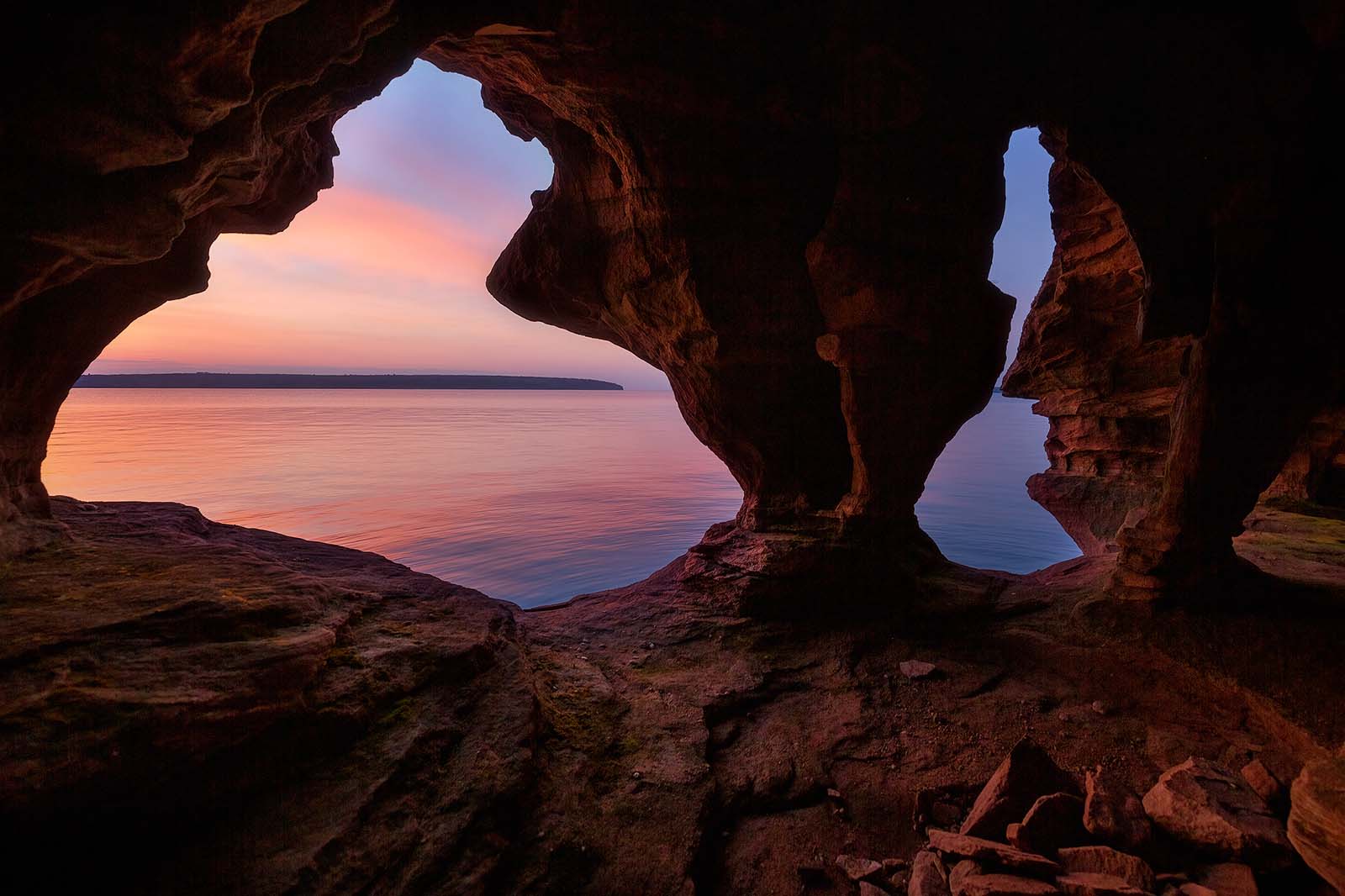 sunrise from inside a sea cave on oak island in the apostle islands
