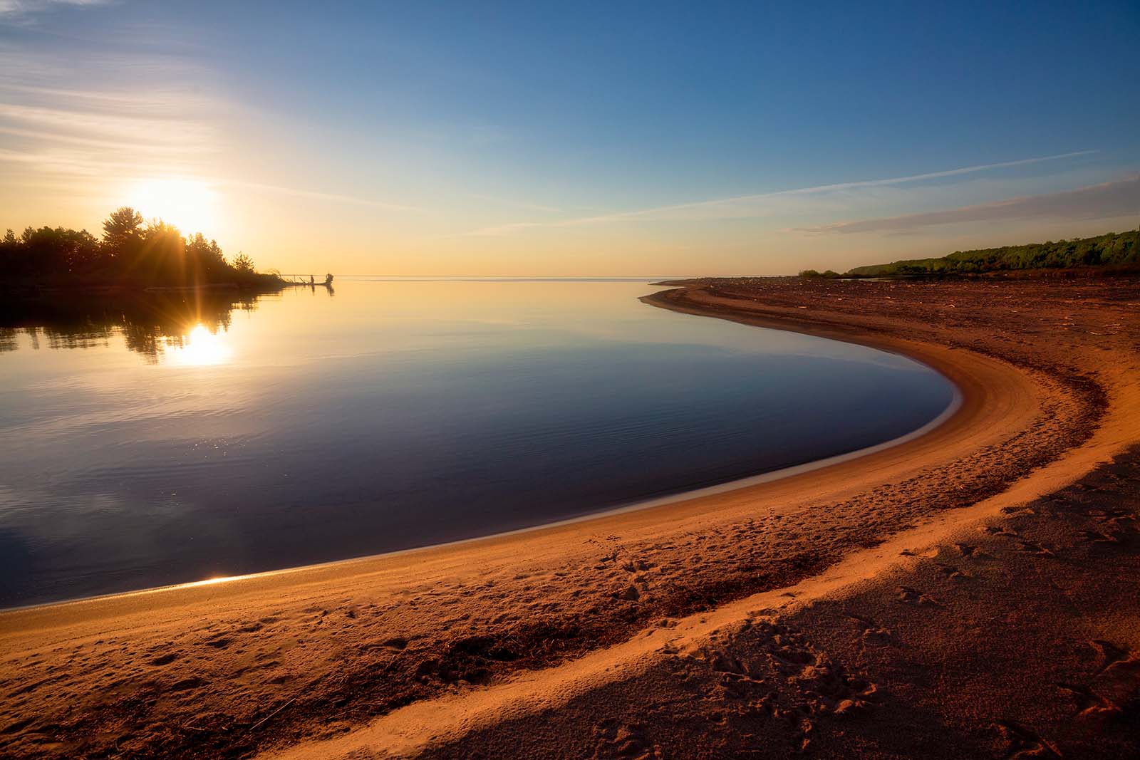 sunset at the outer island lagoon with sandy beach in the apostle islands national lakeshore