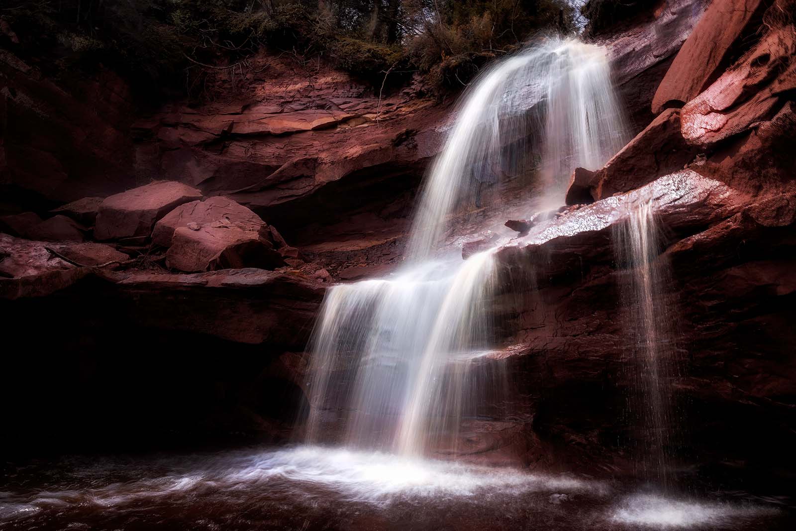 spring snowmelt runoff waterfall in the apostle islands national lakeshore on lake superior wisconsin